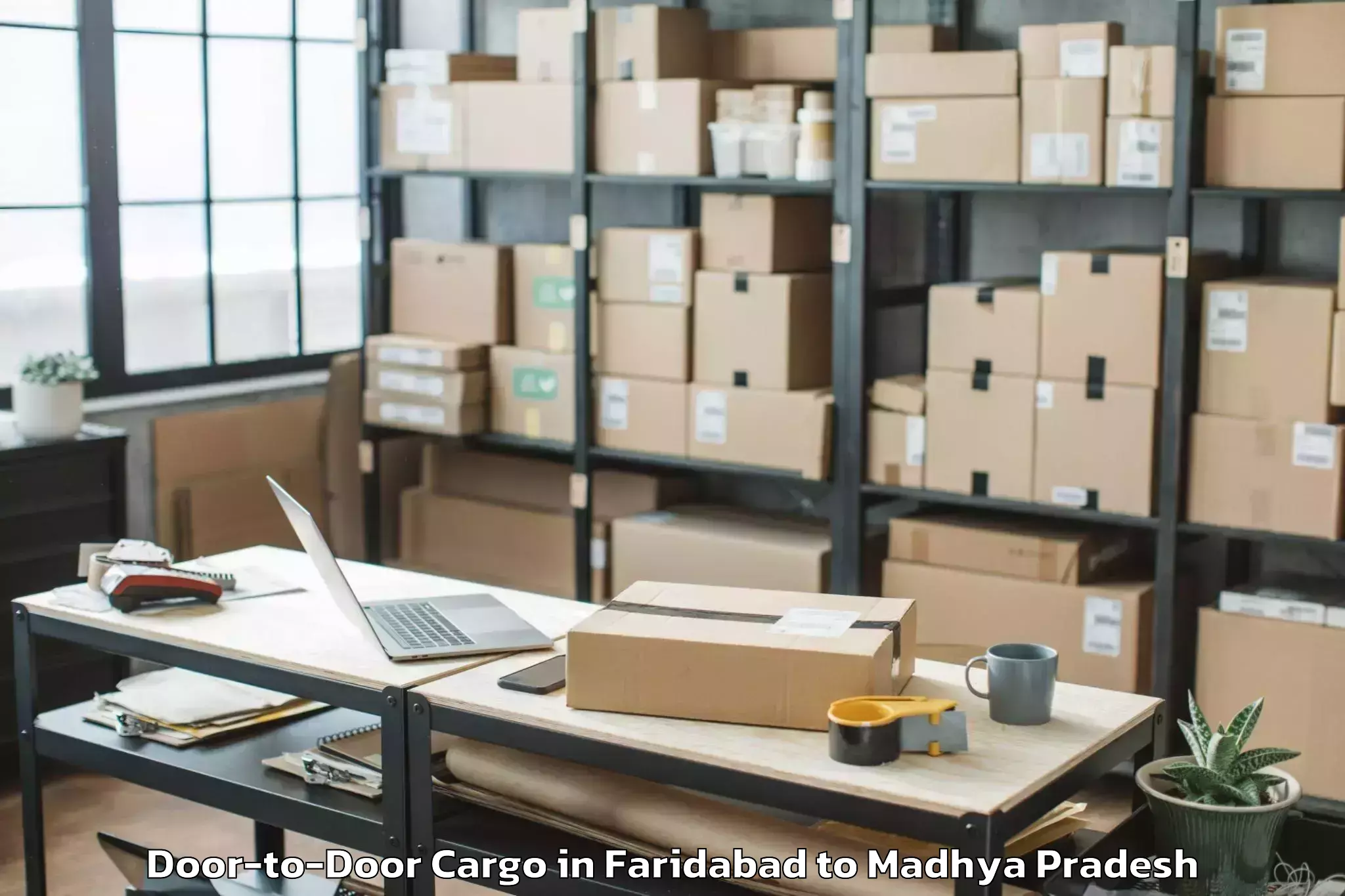 Top Faridabad to Nalkheda Door To Door Cargo Available